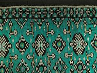 Photo 1 of our Teal and Black Ikat Fabric