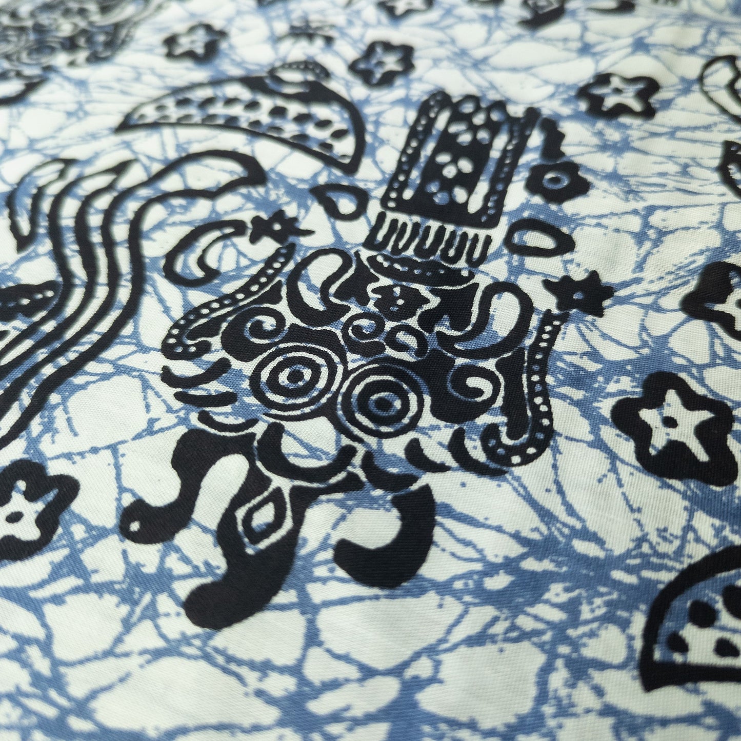 Blue and white crackle batik sarong with Indonesian gods