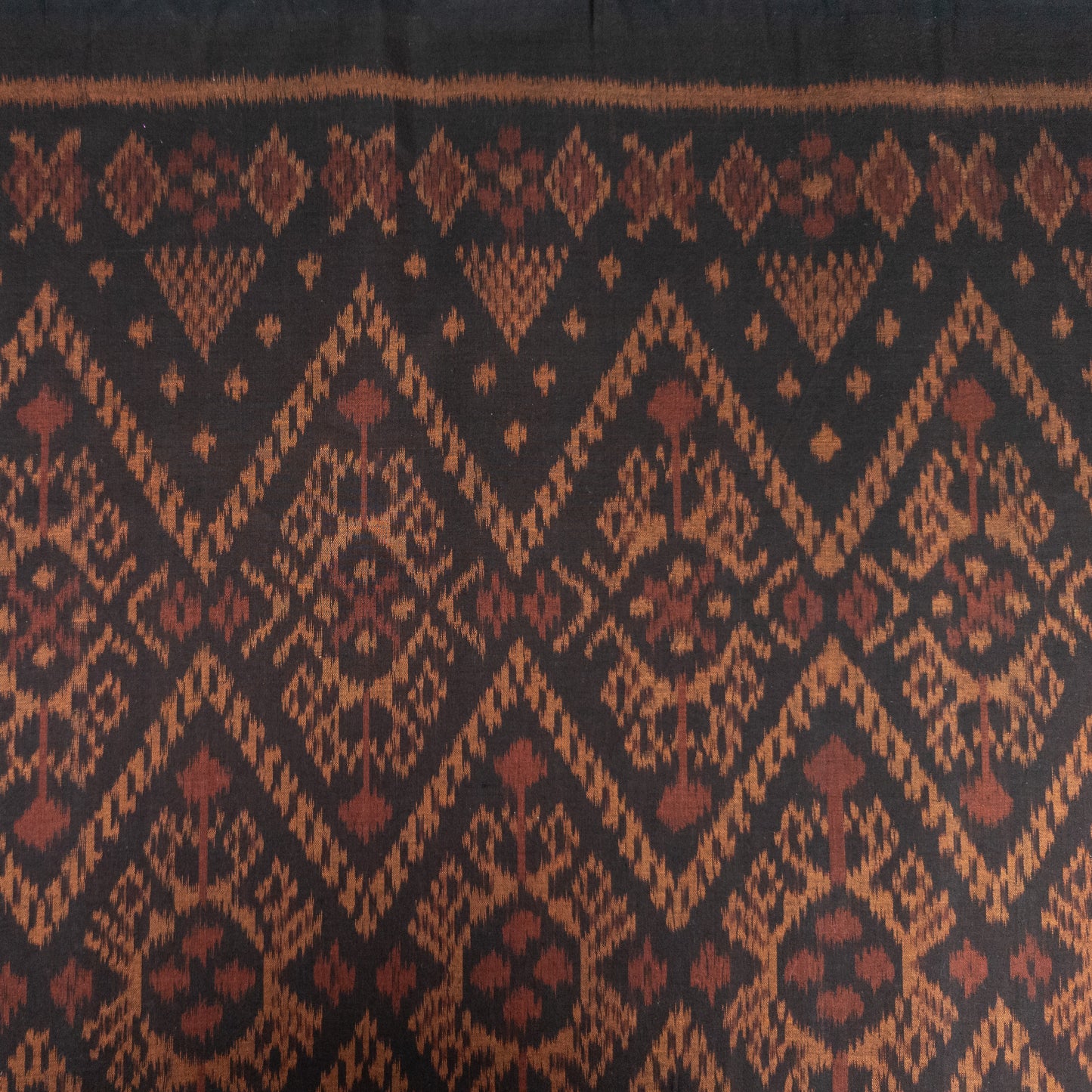 Dark Brown and Red Ikat Remnant | Fat Quarter | 51cm x 53cm - Textile Traders