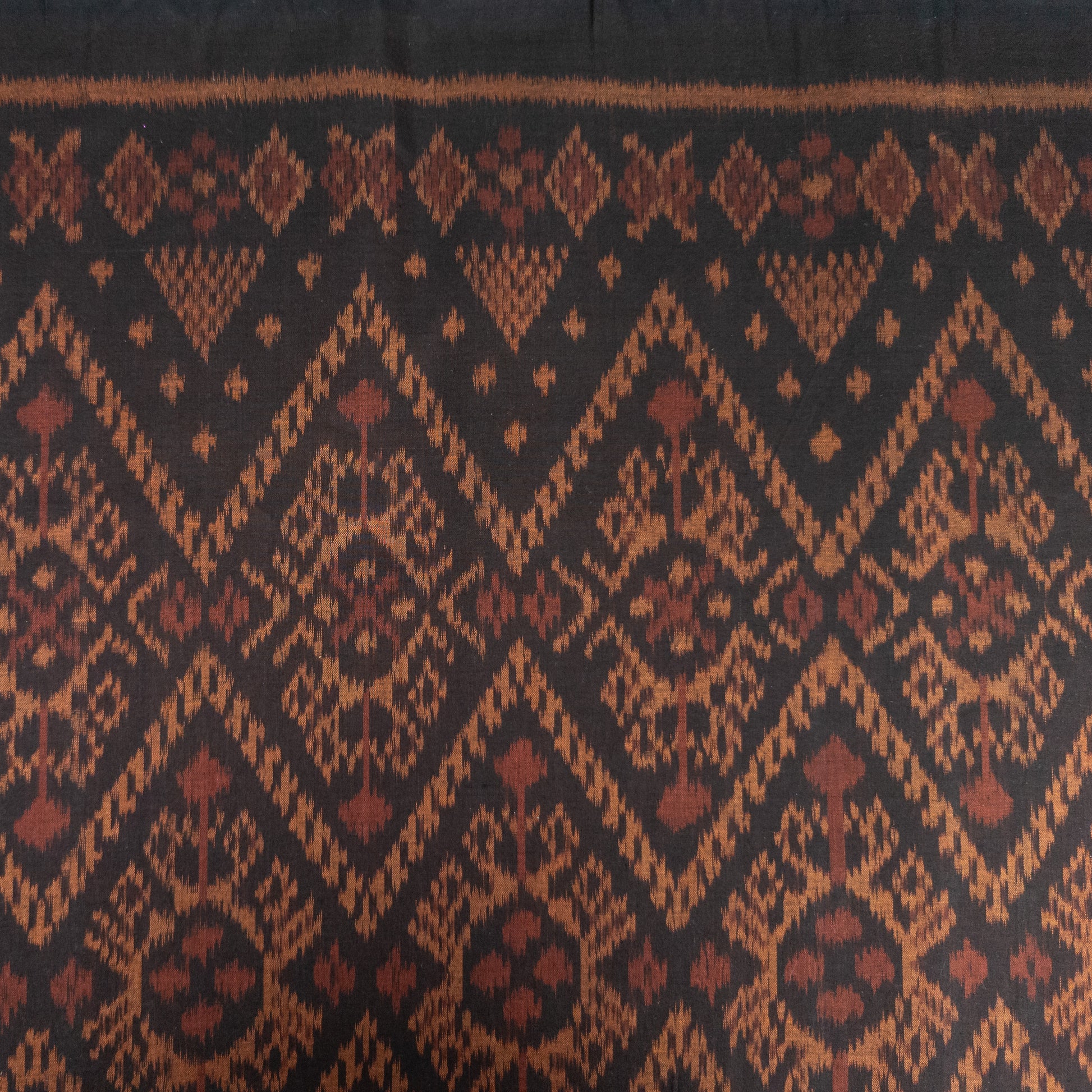 Dark Brown and Red Ikat Remnant | Fat Quarter | 51cm x 53cm - Textile Traders