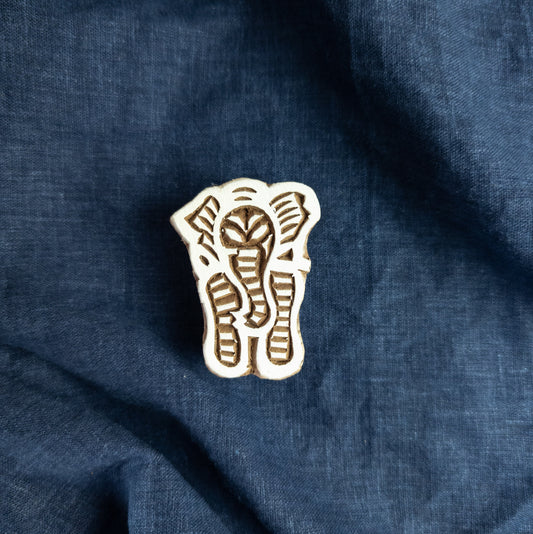 Wooden printing block featuring the front view of an elephant.