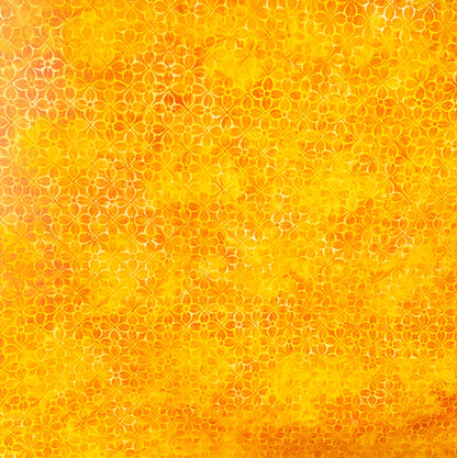 Orange and yellow batik fabric with geometric flower print