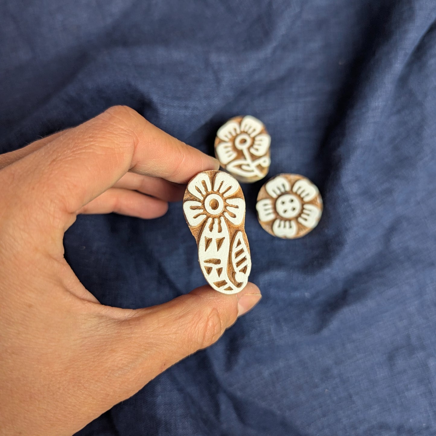 Paisley flower printing block, being displayed as part of a set of floral woodblocks