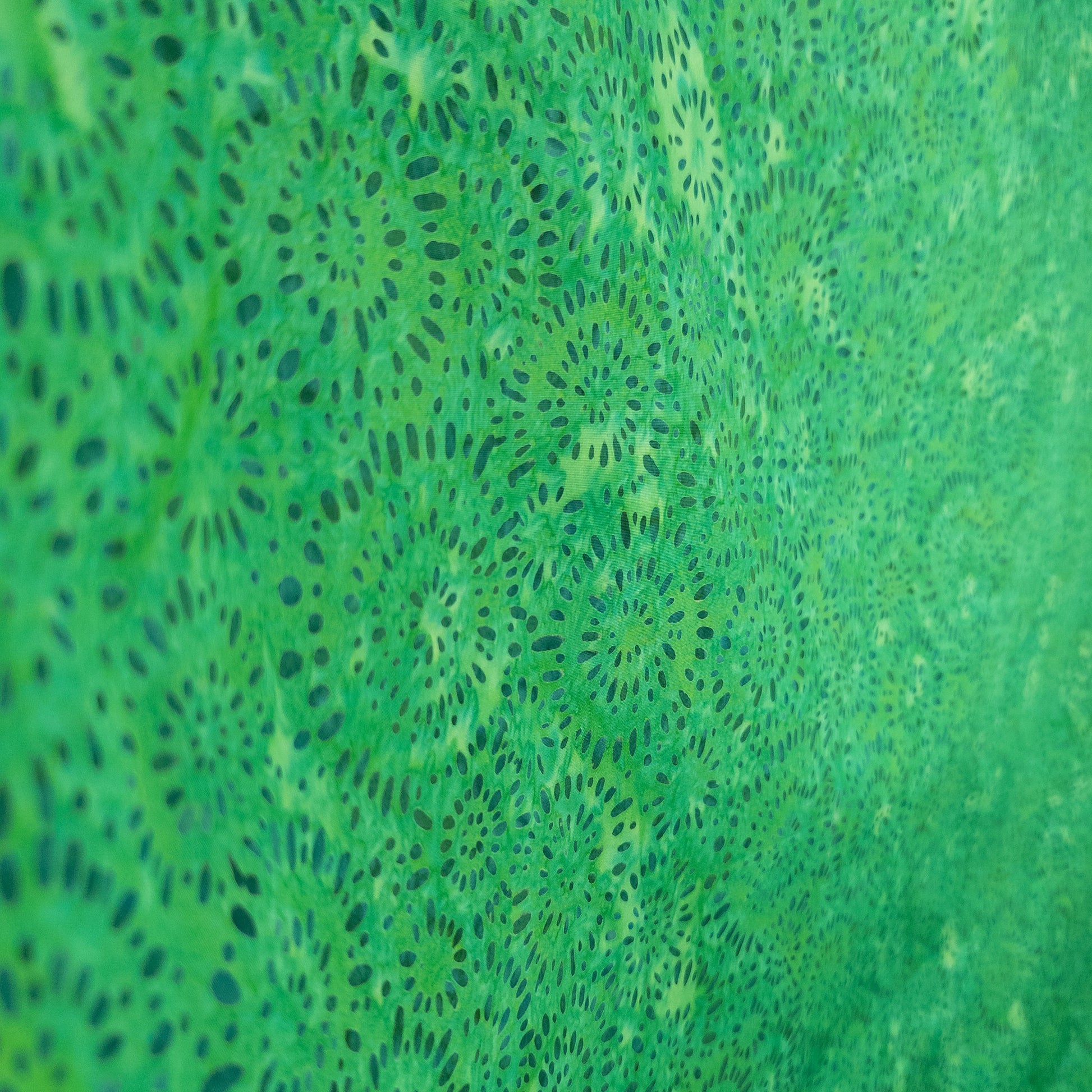 Bright green patterned batik fabric from Java