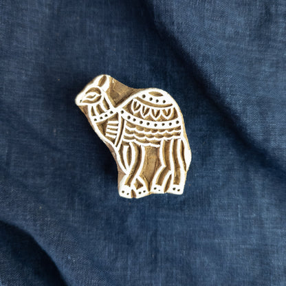 Decorative hand-carved camel woodblock from India.