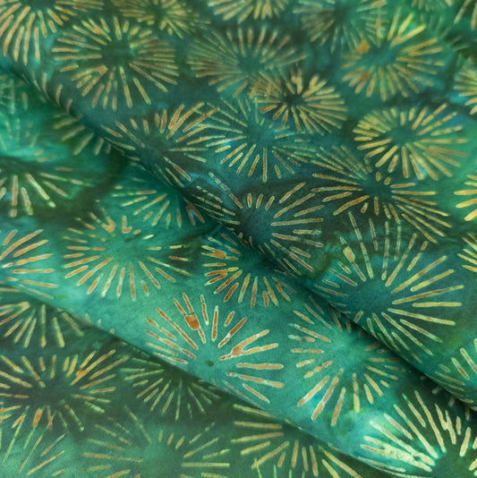 green batik fabric with hand printed starburst design